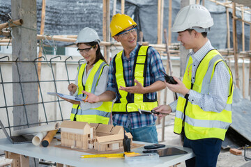 Group architect team on construction site inspection documents and business workflow in the morning.