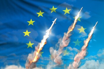 Modern strategic rocket forces concept on blue sky background, European Union ballistic warhead attack - military industrial 3D illustration, nuke with flag