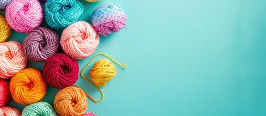 Turkish yarn. Bright rainbow palette of multicolored, cotton threads, hooks and accessories isolated on a pastel background. Copy space image. Place for adding text and design