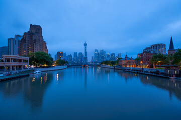 Fototapeta premium view of heavily polluted city skyline and buildings at sunrise in Shanghai