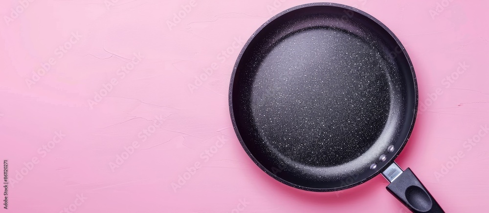 Poster high angle view of the special coating of frying pan pastel background. copy space image. place for 