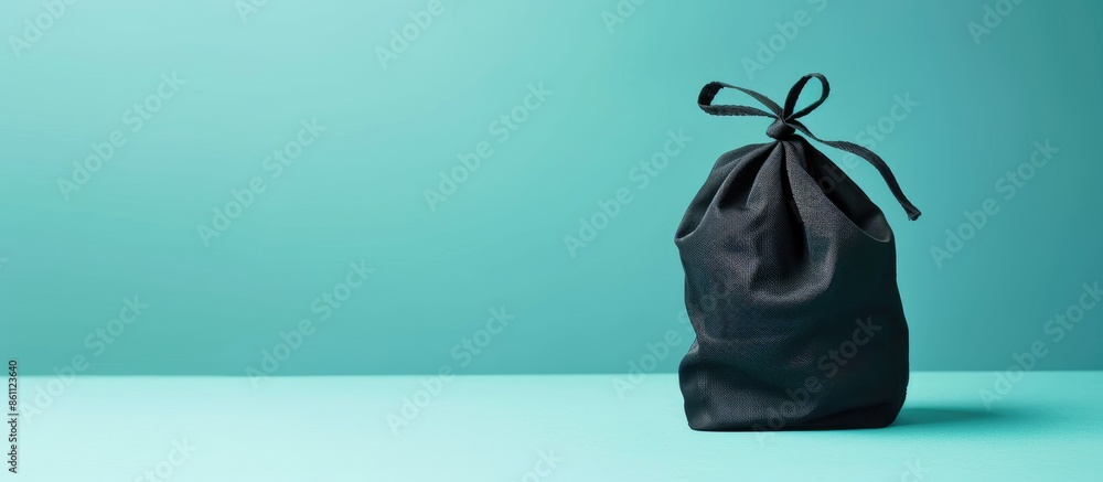 Poster black cloth bag isolated on pastel background, this has clipping path. copy space image. place for a