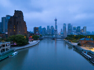 Aerial view of  heavily polluted city skyline and buildings at sunrise in Shanghai