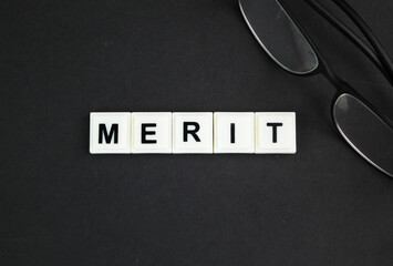 letters of the alphabet with the word Merit. noun. a quality deserving blame. Merit, demerit and...