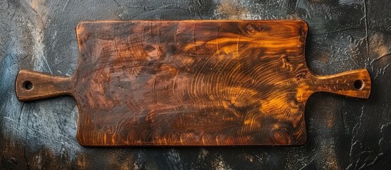 Vintage cutting board. Accessories for cooking at home. Board for cutting products. Cutting board for steaks. Product from different types of wood. Copy space image