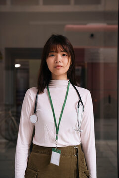 Medical student wearing stethoscope and ID card in hospital