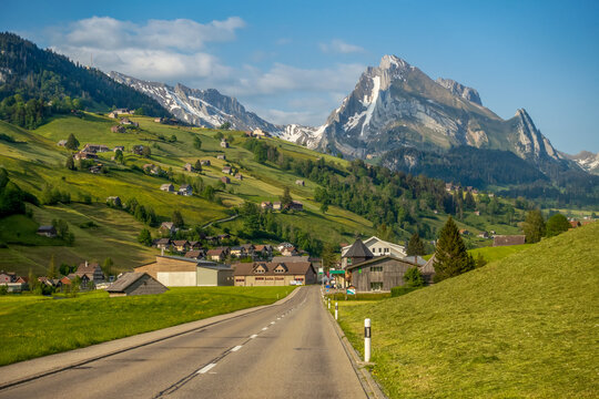 Empty road amidst residential houses near Santis mountain in Switzerland