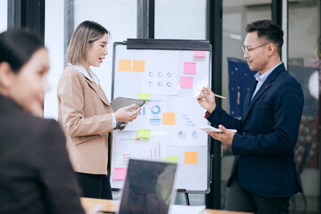 business engage in a brainstorming session, analyzing charts and diagrams. Colleagues, cheerful and proud, celebrate their achievements together.