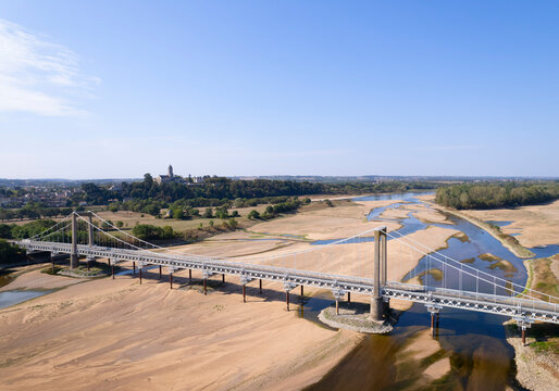 Low water levels in River Loire with bridge in drought climate