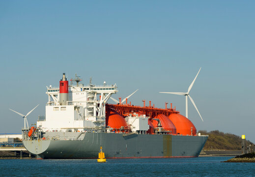 Windturbines and LNG tanker on ship at harbor