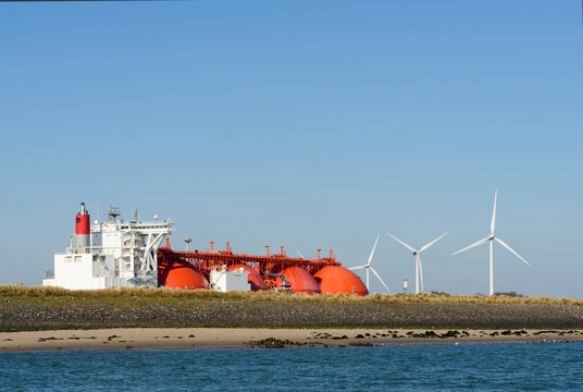 Windturbines and LNG tanker at port