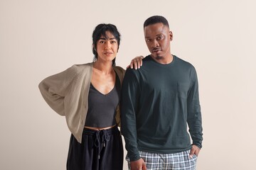 Divers couple in monotone sleepwear