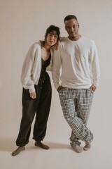 Diverse couple in monotone lounge wear