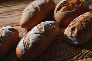 Freshly baked sourdough bread with a golden crust on bakery shelves. Baker shop context with delicious bread