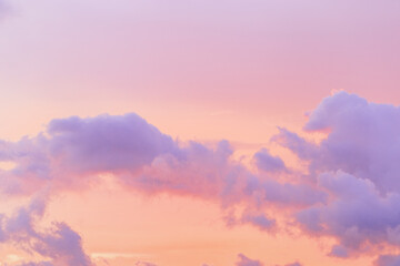 Pastel nature Sunset, purple fluffy clouds on pink colored sky, picturesque landscape pastel tones, soft colorful scenery with vanilla sky, beautiful sunlight lighting heaven in bright colors