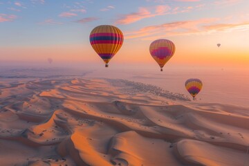 Obraz premium Hot Air Balloons Soaring Over Desert Dunes at Sunrise