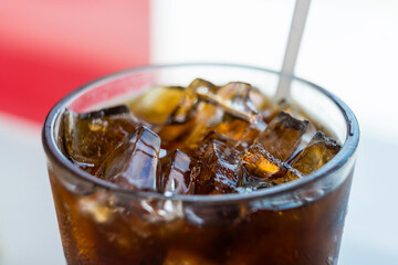 Close-up view of a glass of iced soda on the table in restuarant
