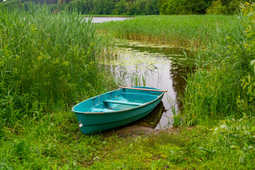 Obraz premium Boat on the shore of the lake, Belarus