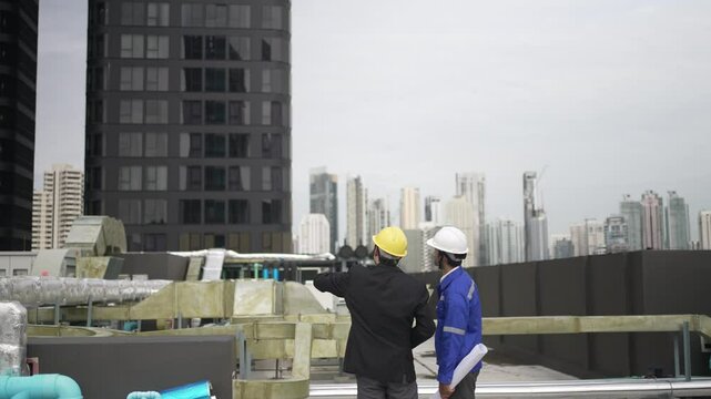 Engineers are checking cooling system at rooftop.