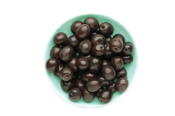 Blue bowl of pickled black olives isolated on white background, top view