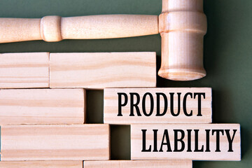 PRODUCT LIABILITY - words on wooden blocks on a white background with a judge's gavel.