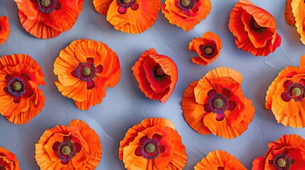 A close up of orange flowers with a grey background