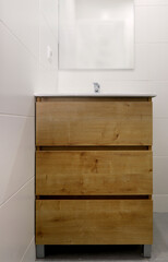 wooden cabinet with recessed washbasin front view