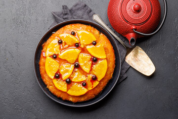 Sweet cake with orange slices and berries