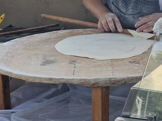 woman making azerbaijan qutab is greens