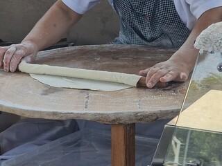 woman making azerbaijan qutab is greens