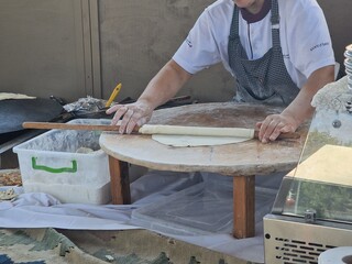 woman making azerbaijan qutab is greens