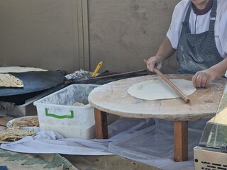 woman making azerbaijan qutab is greens