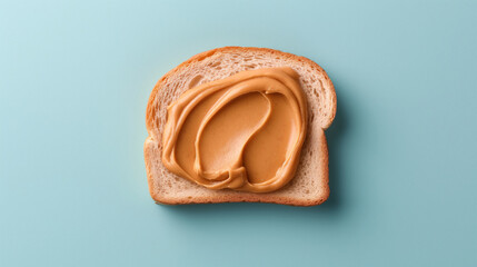 Single slice of toast with peanut butter on a blue background.