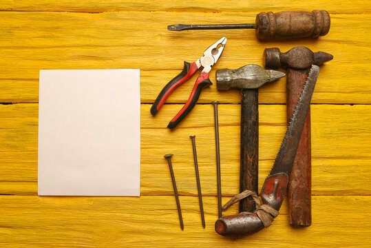 Construction concept background. Building work tool on the wooden workbench background. Top view. Flat lay. Fix list mockup.