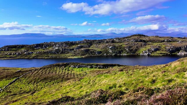 Ireland Epic Locations ships Head Peninsula fresh water lake with Bantry bay and Mountains of Kerry in Background in summer