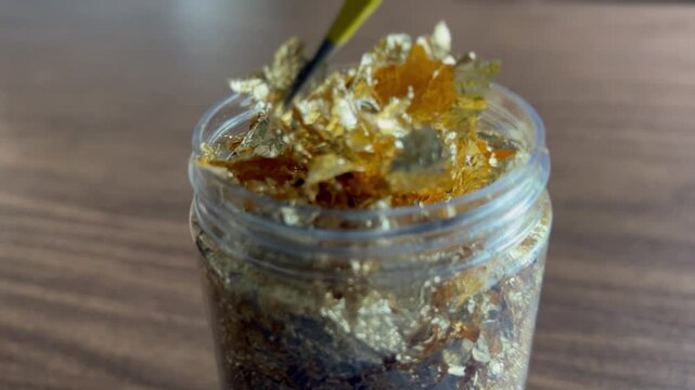 Gold flakes used for face painting and cooking, 24 karat yellow gold