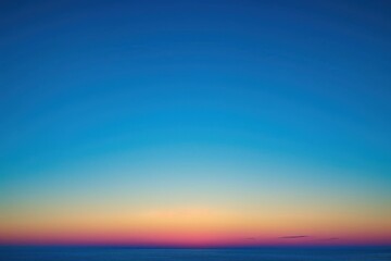 Obraz premium Sunset sky gradient from yellow to blue, copy space. Clear sunset sky with the bright light of the setting sun