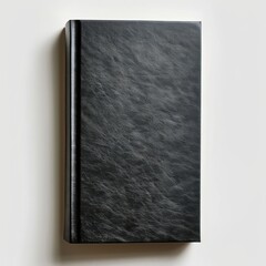Fototapeta premium Blank black vertical book cover on white paper background.