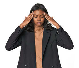 Young Indian woman in business suit touching temples and having headache.