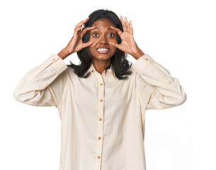 Portrait of a young Indian woman keeping eyes opened to find a success opportunity.