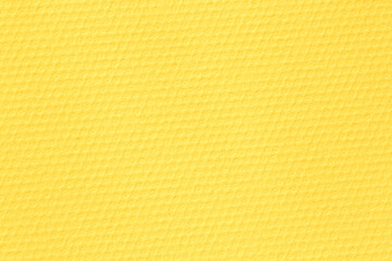 close up of yellow paper textured as honeycombs