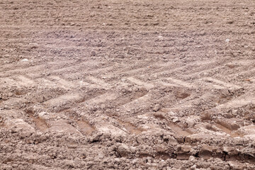 
tractor tire tracks on the ground