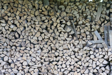 
a pile of firewood piled on top of one another