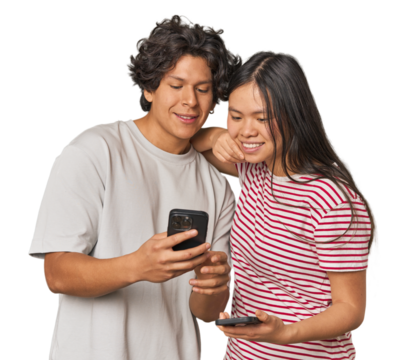 Multiracial young couple engaged with smartphones in studio