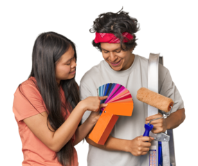 Happy multiracial couple with painting tools in studio
