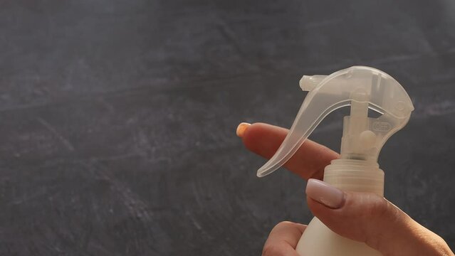 Water pours from bottle in slow motion, capturing intricate details of droplets in air. Ideal for themes related to water, refreshment and hydration. Shot highlights the beauty and fluidity of water.