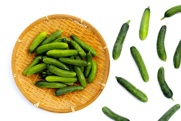 Mini cucumbers on white background.