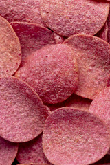 adding red dye to potato chips