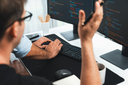 IT developers creating online software development information on screen laptop with coding program in data of application and website. Technical engineer coder on safety program concept. Sellable.