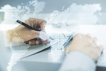 Multi exposure of abstract creative digital world map and hand writing in notebook on background...